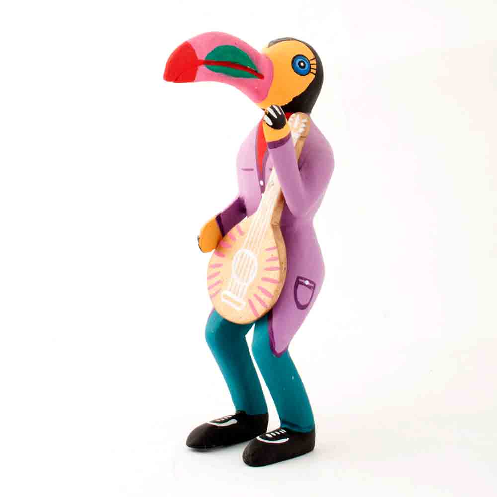 Wooden toucan with violin by Juventino Melchor